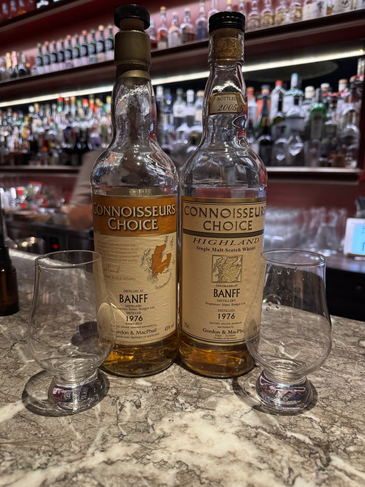 Client-supplied bottle photo of Gordon & Macphail Banff 1976 2010 43% (left foreground bottle)