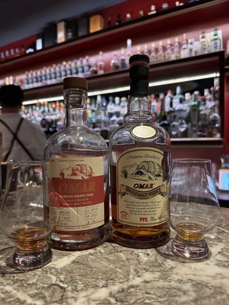 Client photo: Omar bottle on the right and tasting glass; another bottle stands on the left.