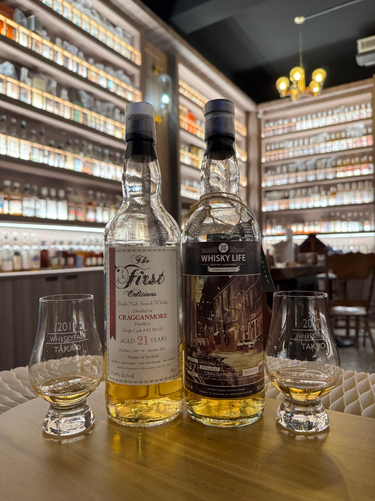 Client-supplied bottle photo of The First Editions Cragganmore 1989 2011 21 Years Old 55,4% Cask ES001/01 (left foreground bottle)
