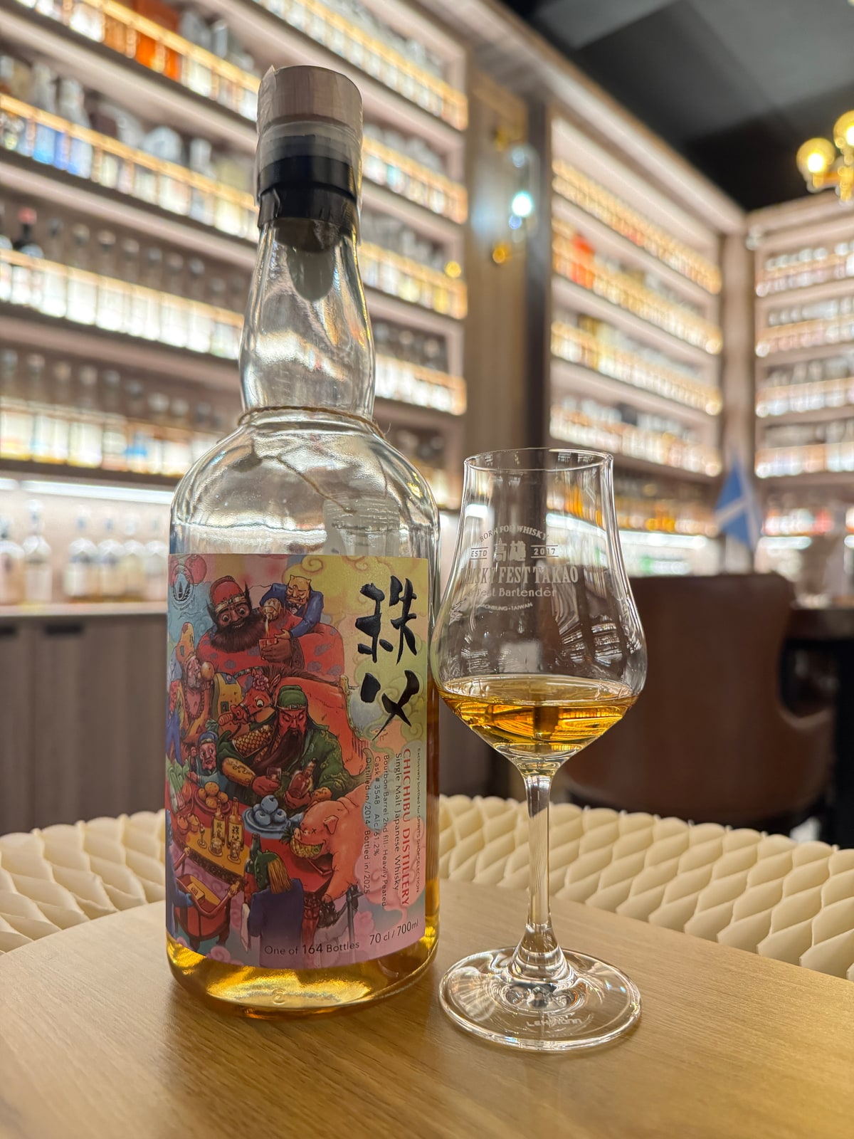 Client-supplied photo of Chichibu distilled in 2014 and bottled in 2025 at 61.2%, cask 3548, with an illustrated label beside a whisky glass.
