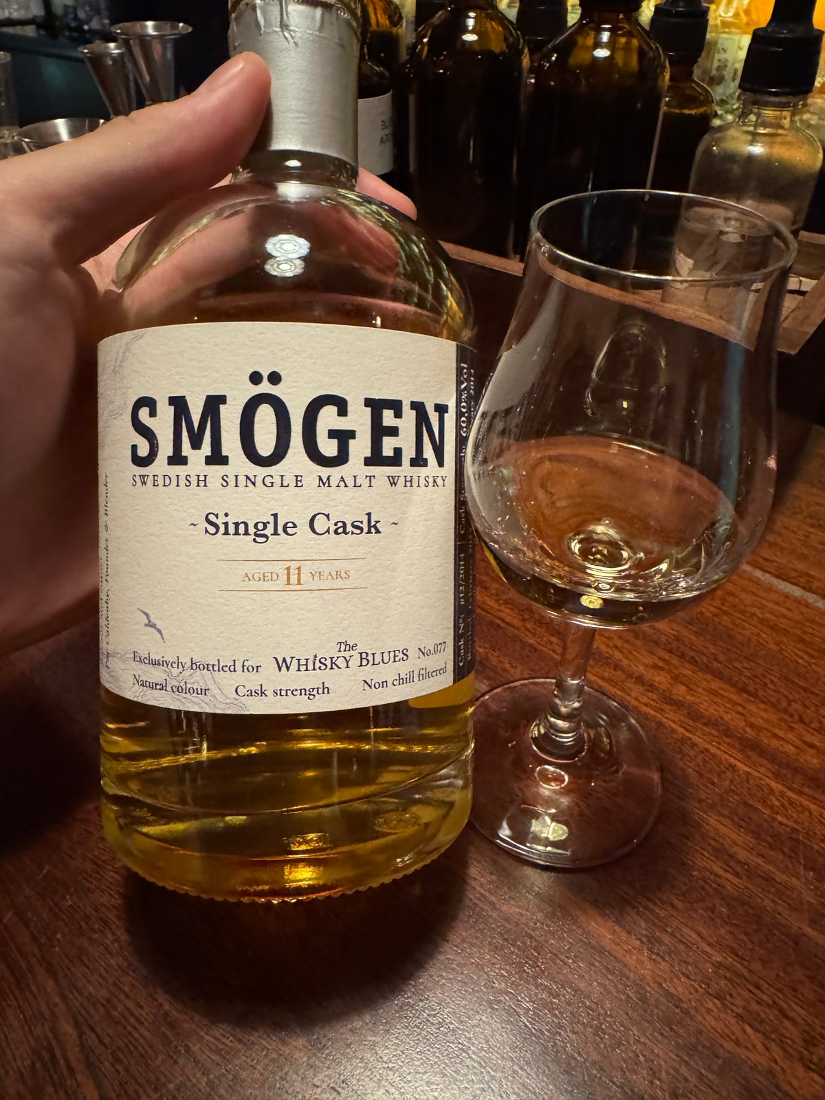 Client-supplied foreground bottle photo of Smogen Single Cask 60% 2014 2025 bottled for Whisky Blues