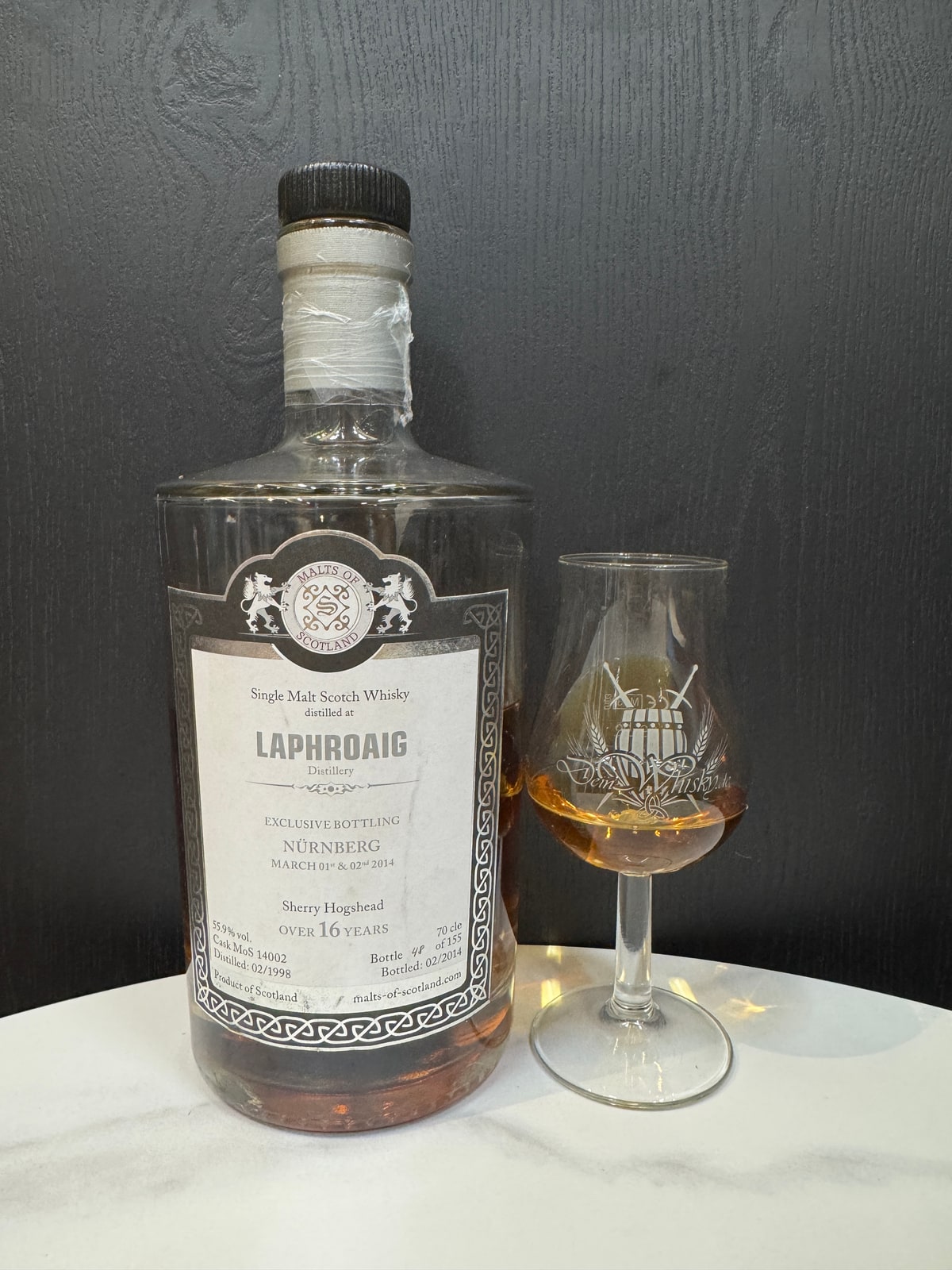 Client photo: Malts of Scotland Laphroaig, Nürnberg exclusive, distilled 02/1998, bottled 02/2014, over 16 years, 55.9%, with glass. Whole original frame.