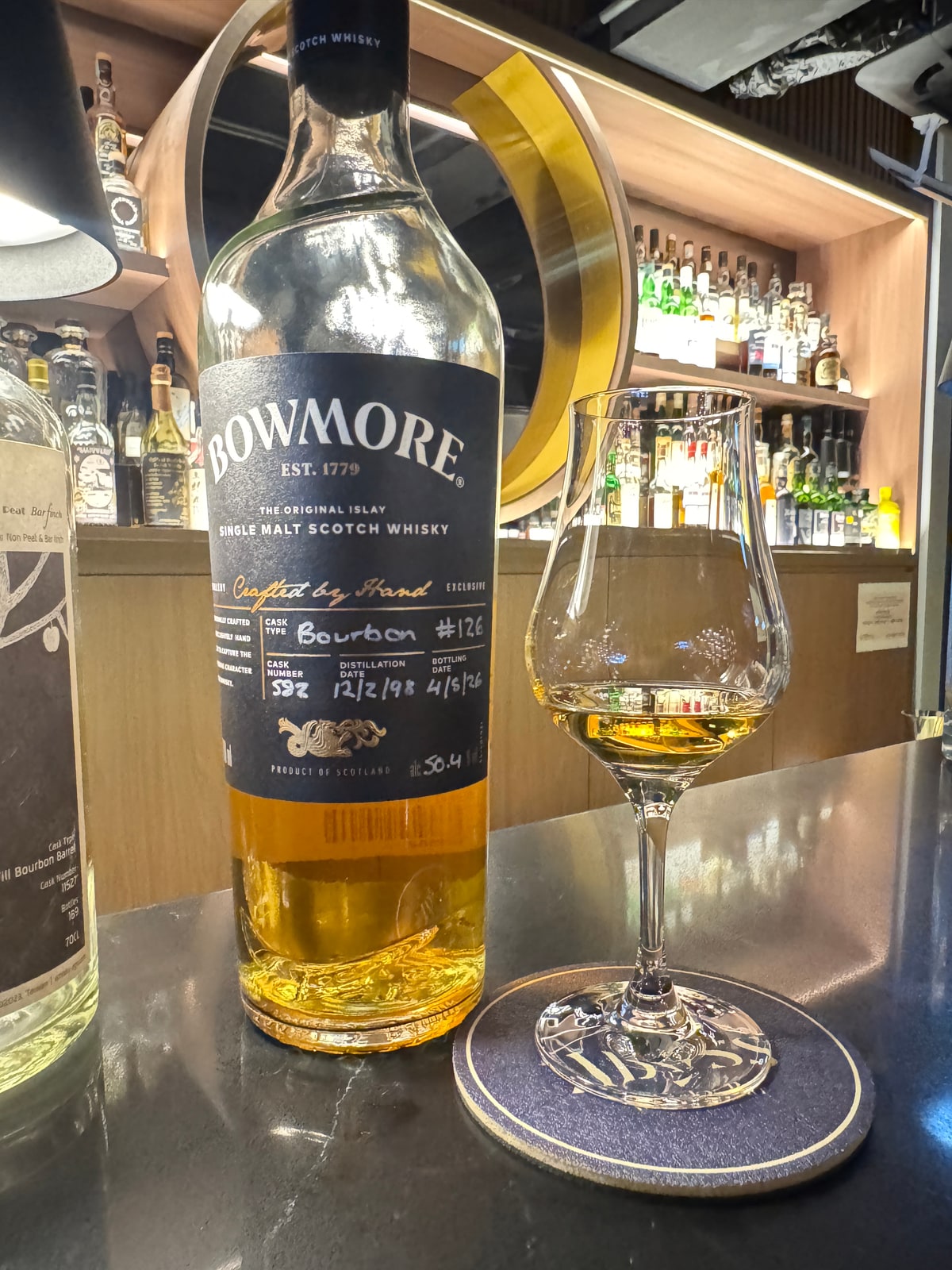 Illustrative image · Illustrative client photo: Bowmore 1998/2026, 50.4%, bourbon cask 582; age not printed.