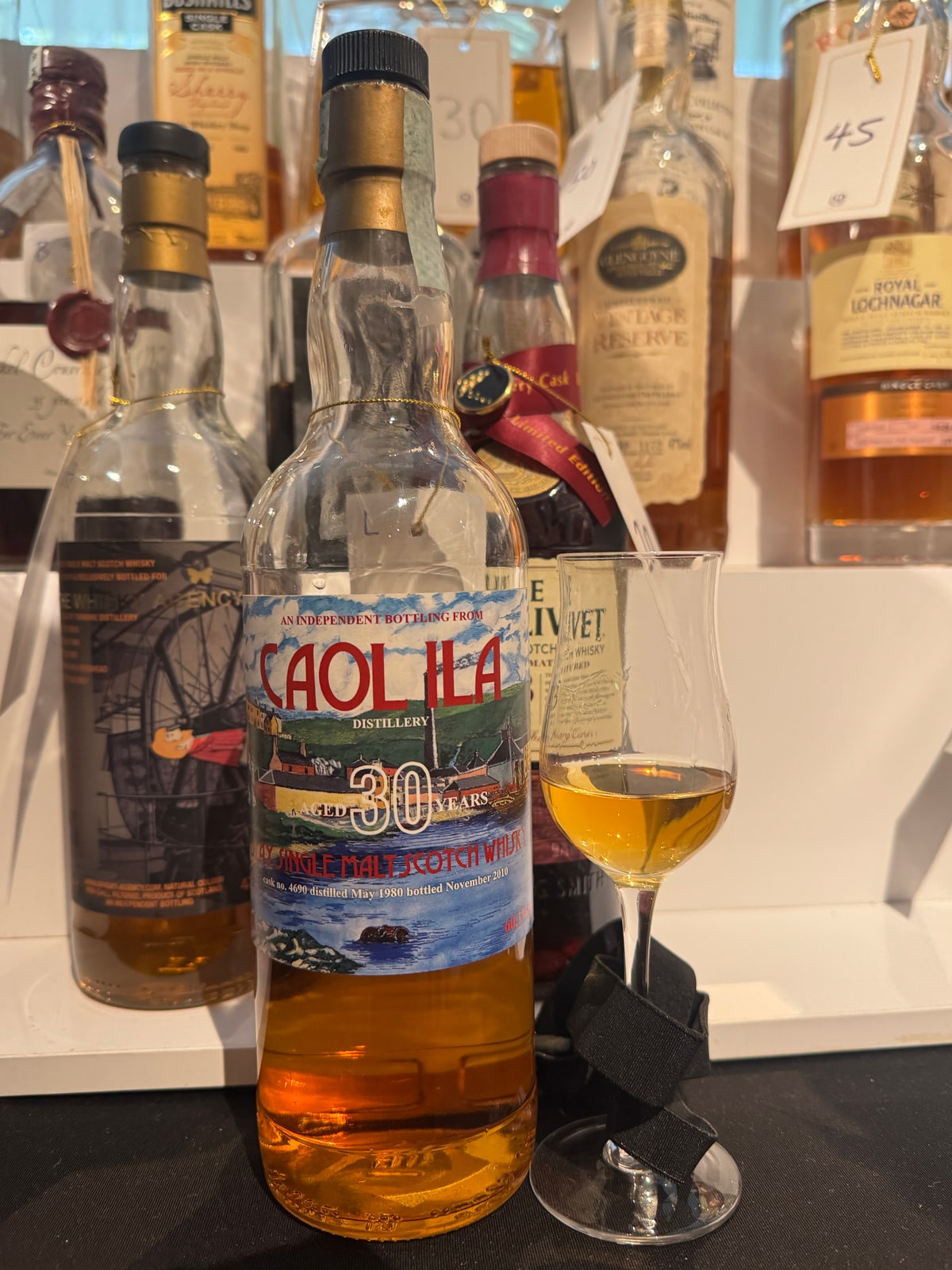 Illustrative image · Illustrative client photo: Caol Ila 1980/2010, 30y, 60.1%, cask 4690, with glass; bottler unverified.