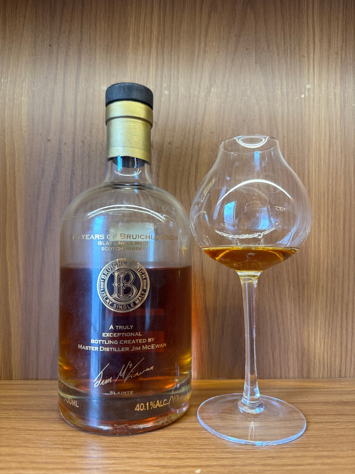 Bruichladdich 125th Anniversary supplied bottle photograph, with a tasting glass beside it