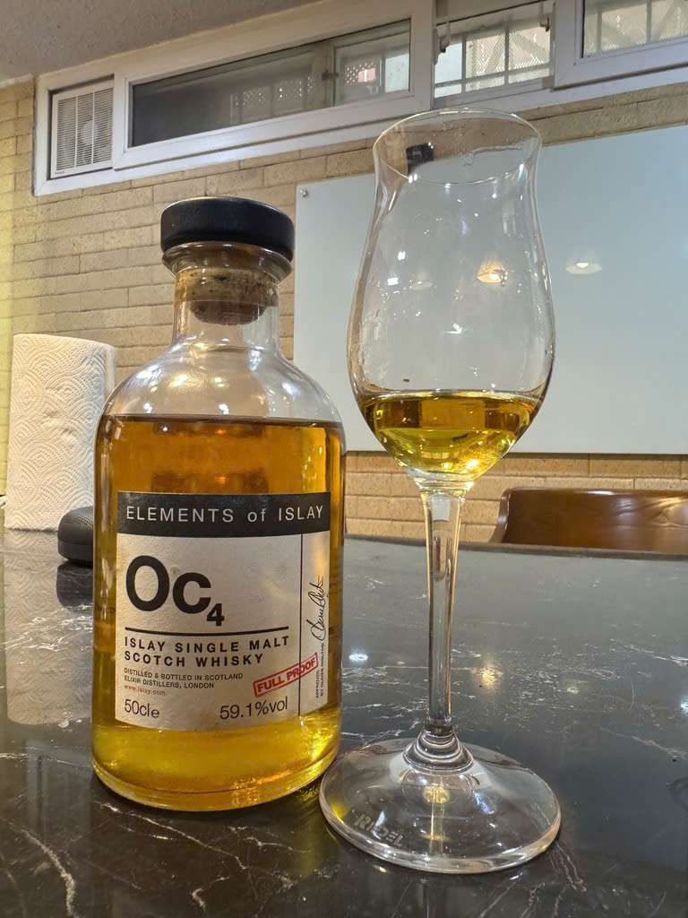 Client photo: Elements of Islay Oc4, 59.1%, 50cl, with glass; the reviewed 2010/2017 dates are not shown on the visible label.
