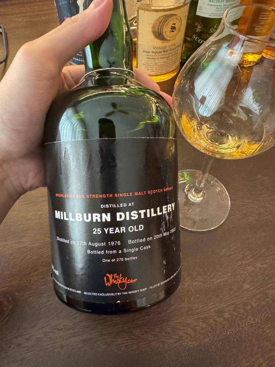 Illustrative image · Illustrative — Client photo: DL Millburn 1976/2002, 25 years; label close-up, ABV partly hidden.