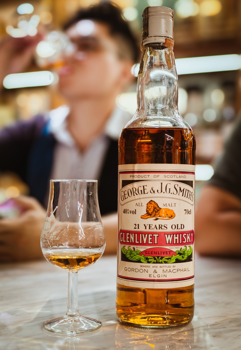 Illustrative image · Illustrative — Client photo: G&M Glenlivet 21/40% with glass; bottling decade not printed.