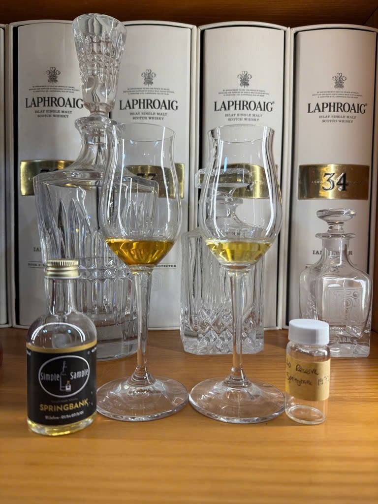 Client photo: Springbank tasting samples and glasses; La Réserve Springbank 1972 is the right sample; Laphroaig boxes behind.